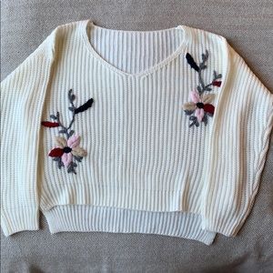 White knit sweater with floral accents